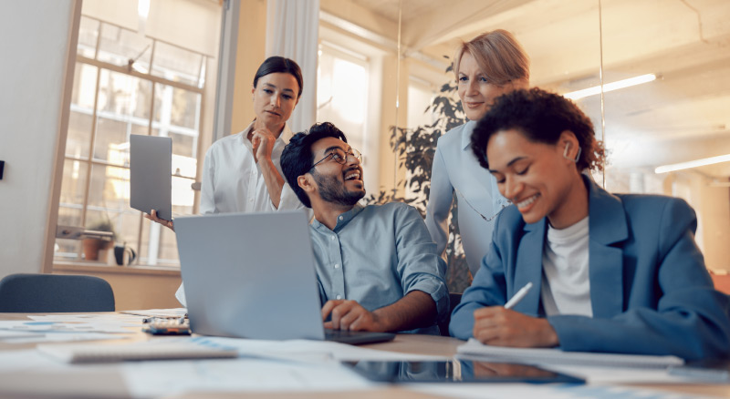 Professionals discussing work in a bright office