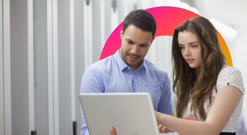 Man and woman looking at computer