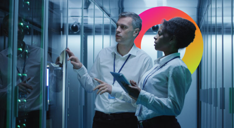 Man and woman workiing in a server room