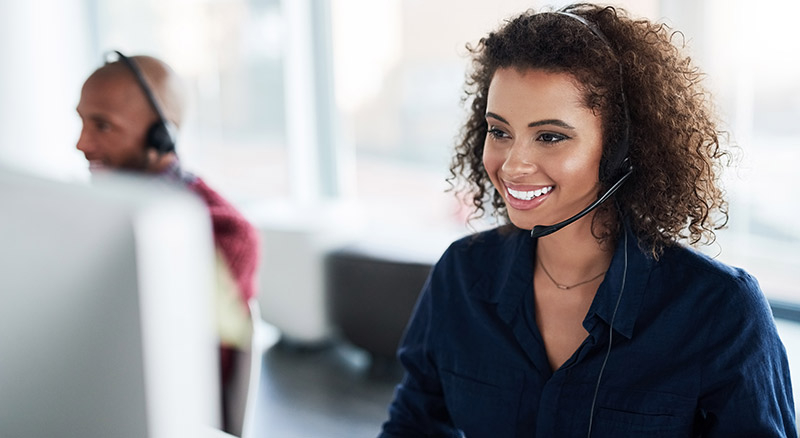 A person in a contact center with a headset on