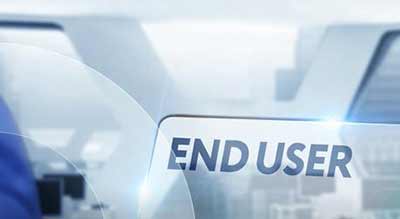 A clear surface with the bold text 'END USER' set against a blurred office equipment background