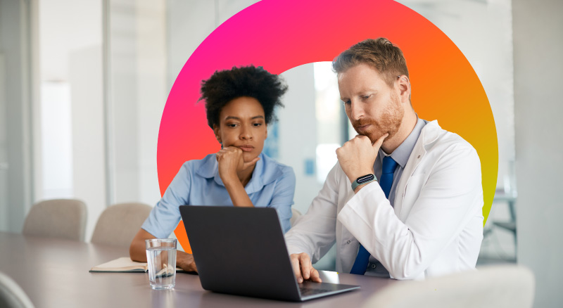 Doctor and nurse using laptop while working at clinic