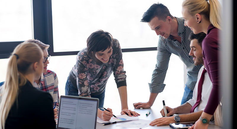A group of professionals being productive in office environment