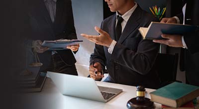 People having meeting in front of laptop