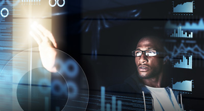 A person reach out in front of him with right hand touching a holographic screen