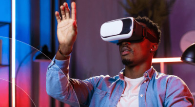 A person wearing a virtual reality headset and interacting with the virtual environment