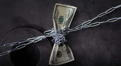 A U.S. 100 dollar bill tied up in chains - IT spend otpimization thumbnail
