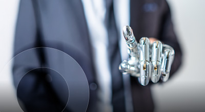 A close up of a chrome robotic hand with index finger pointing