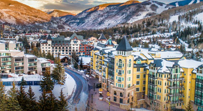 A city landscape surrounded by mountains