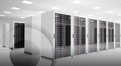A modern data center with rows of tall, sleek server racks in a clean, well-lit room
