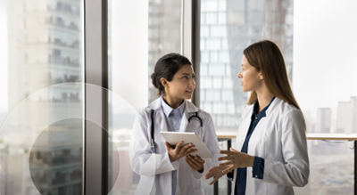 Two healthcare professionals having a conversation