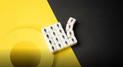a black and yellow background with domino tiles in the center