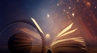 An open book with a starry background
