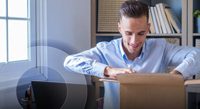 An employee reaching into box