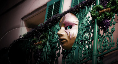 A mask on a green balcony