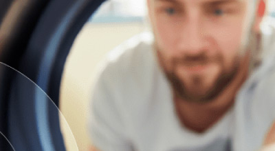 Man with his hand in the laundry