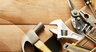 Various tools on a wooden background