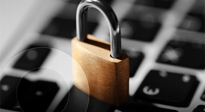 A padlock resting on a computer keyboard, symbolizing security and protection of digital information.