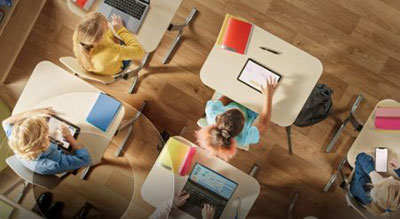 Children in a classroom on desks