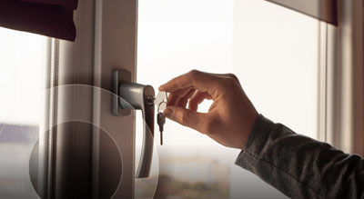 a close up of a hand using a key to unlock a door supply chain risk management article thumbnail