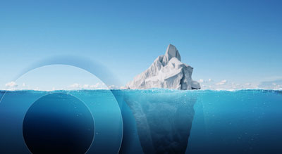 A skyline that shows an iceberg both above and below sea level