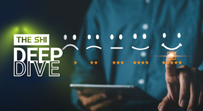 Close up of a person holding tablet in one hand and pointing with the other The shi Deep dive whitepaper thumbnail
