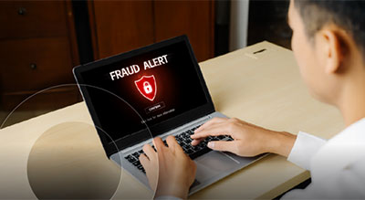 Fraud alert on laptop