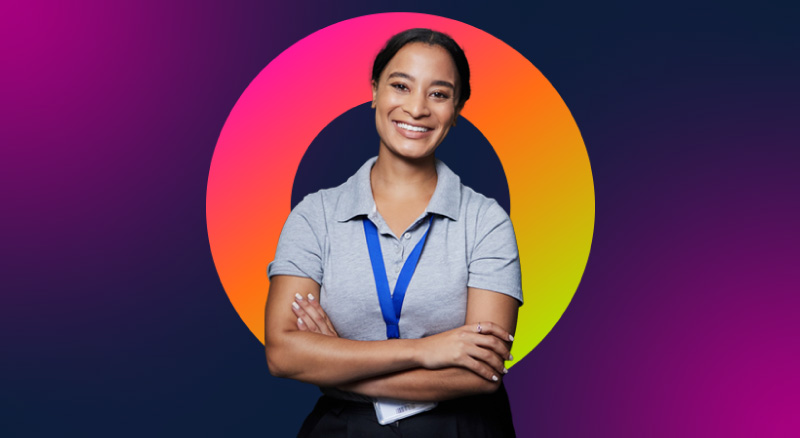 A confident IT professional standing with their arms crossed
