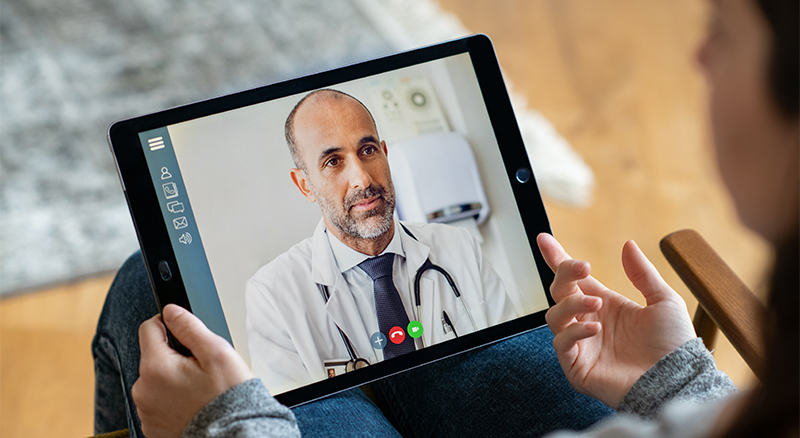 A person engaged in a video chat while holding a tablet, showcasing a modern communication experience