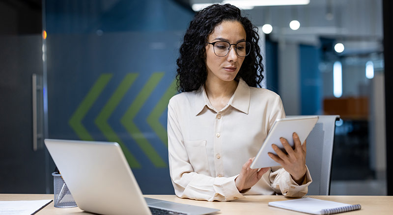 Employee finding information on a tablet