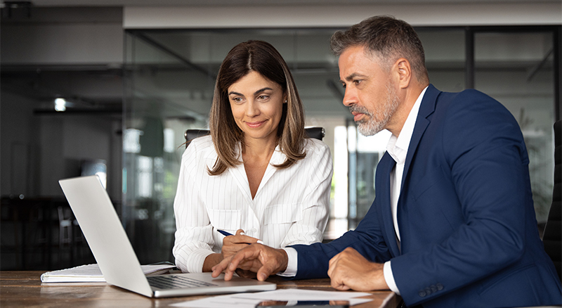 Two individuals collaborating in an office setting
